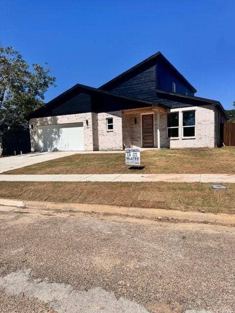 503 Richardson Street, Athens, TX 75751 View of front of property with a garage and a front yard