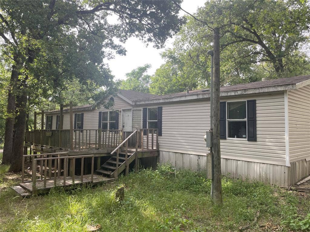 2998 County Road 1703, Malakoff, TX 75148 Back of property featuring a deck