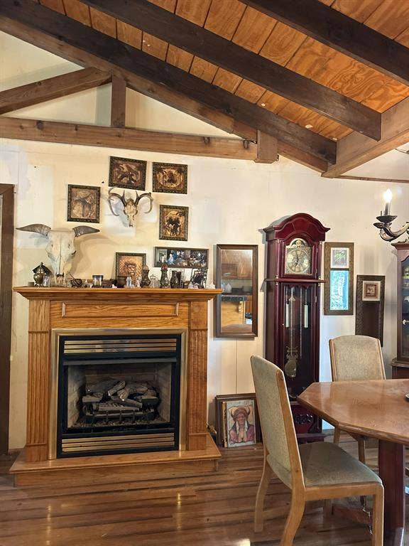 11420 County Road 420, Tyler, TX 75704 Dining room featuring hardwood / wood-style flooring, wood ceiling, and lofted ceiling with beams