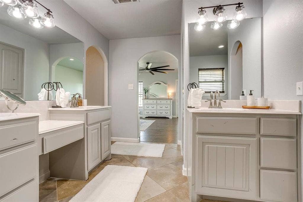 12001 Fm 2331, Godley, TX 76044 Bathroom with vanity, wood-type flooring, and ceiling fan