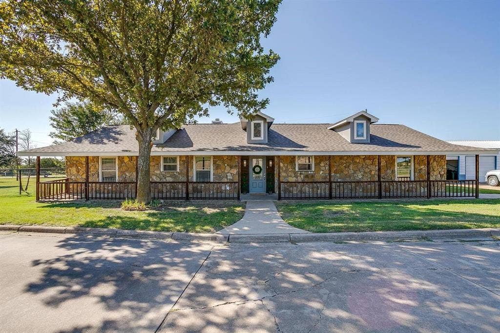12001 Fm 2331, Godley, TX 76044 View of front of house with covered porch and a front lawn