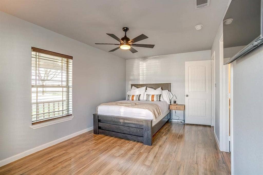 12001 Fm 2331, Godley, TX 76044 Bedroom featuring ceiling fan and light hardwood / wood-style flooring