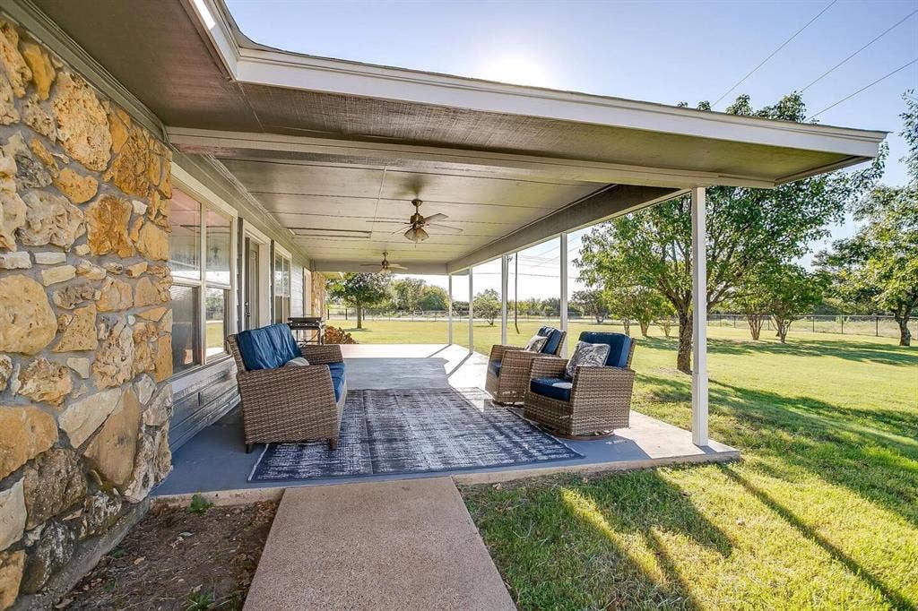 12001 Fm 2331, Godley, TX 76044 View of patio with ceiling fan and an outdoor hangout area