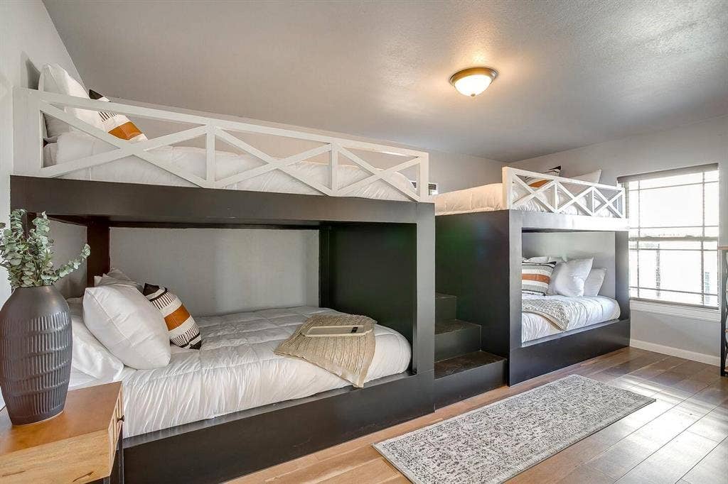 12001 Fm 2331, Godley, TX 76044 Bedroom with a textured ceiling and hardwood / wood-style flooring
