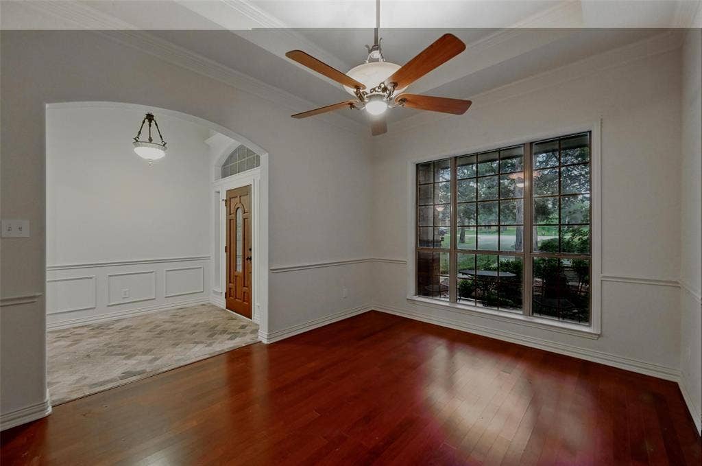 3421 Mindy Lane, Midlothian, TX 76065 Formal dining or multi purpose room, featuring crown molding, arched walkways, a ceiling fan, and wood finished floors