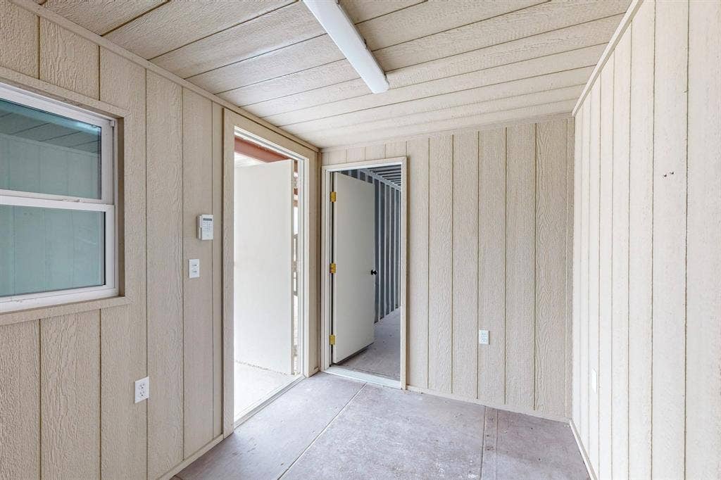 409 Copper Canyon Road, Argyle, TX 76226 Corridor with wooden walls
