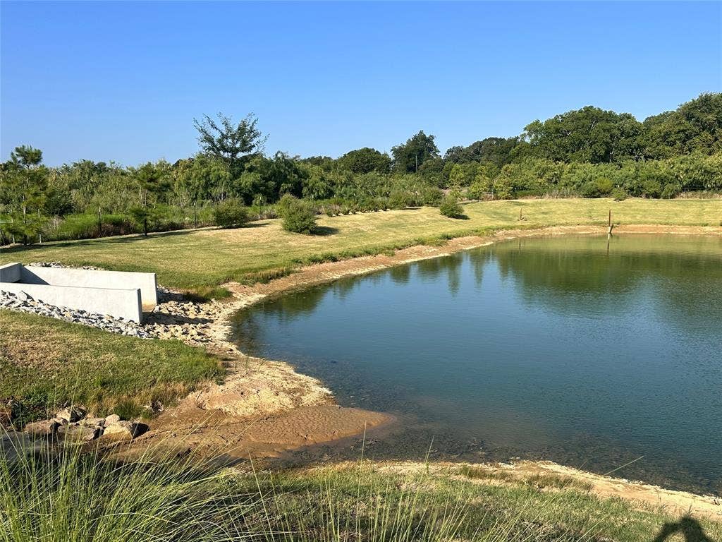128 Park Avenue, Keller, TX 76262 Expansive pond with surrounding grassy areas and mature trees