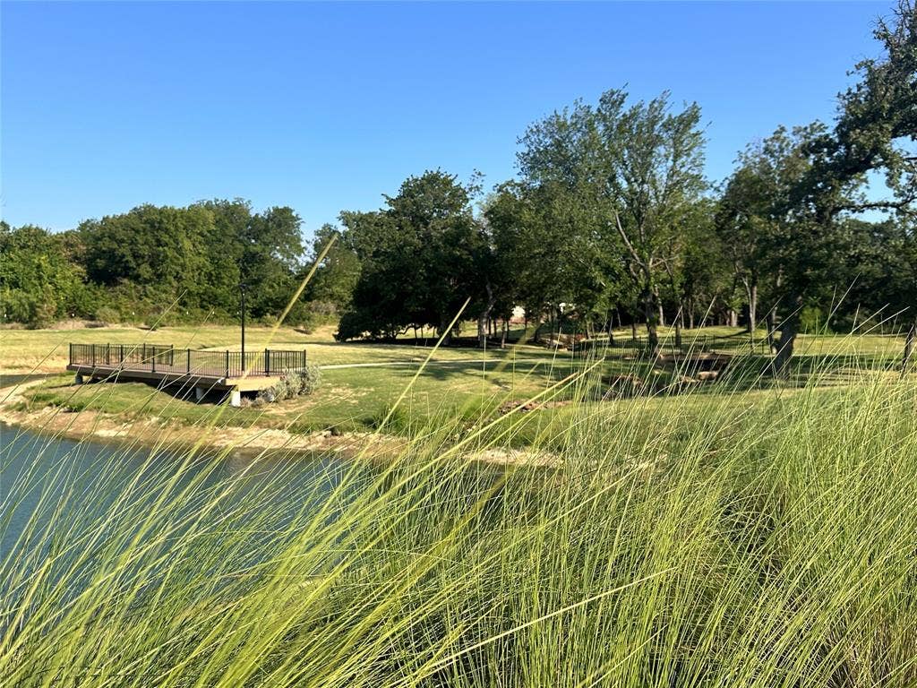 300 Park Avenue, Keller, TX 76262 Expansive pond with surrounding grassy areas and mature trees