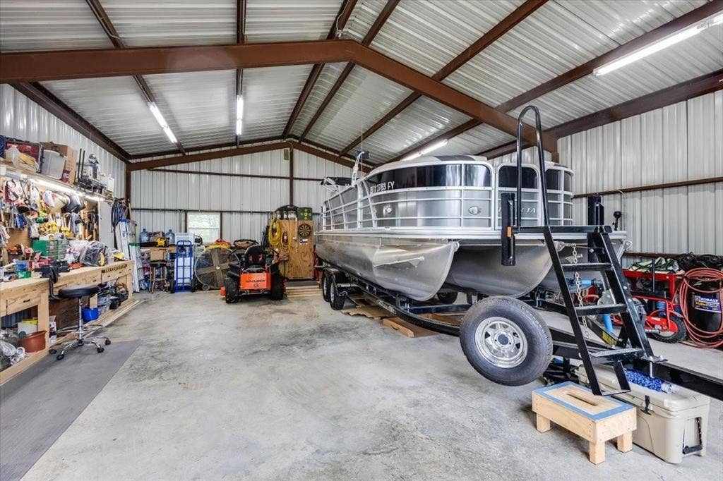 Garage with a workshop area and metal wall
