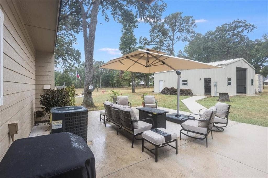 View of patio featuring central AC unit and an outdoor living space
