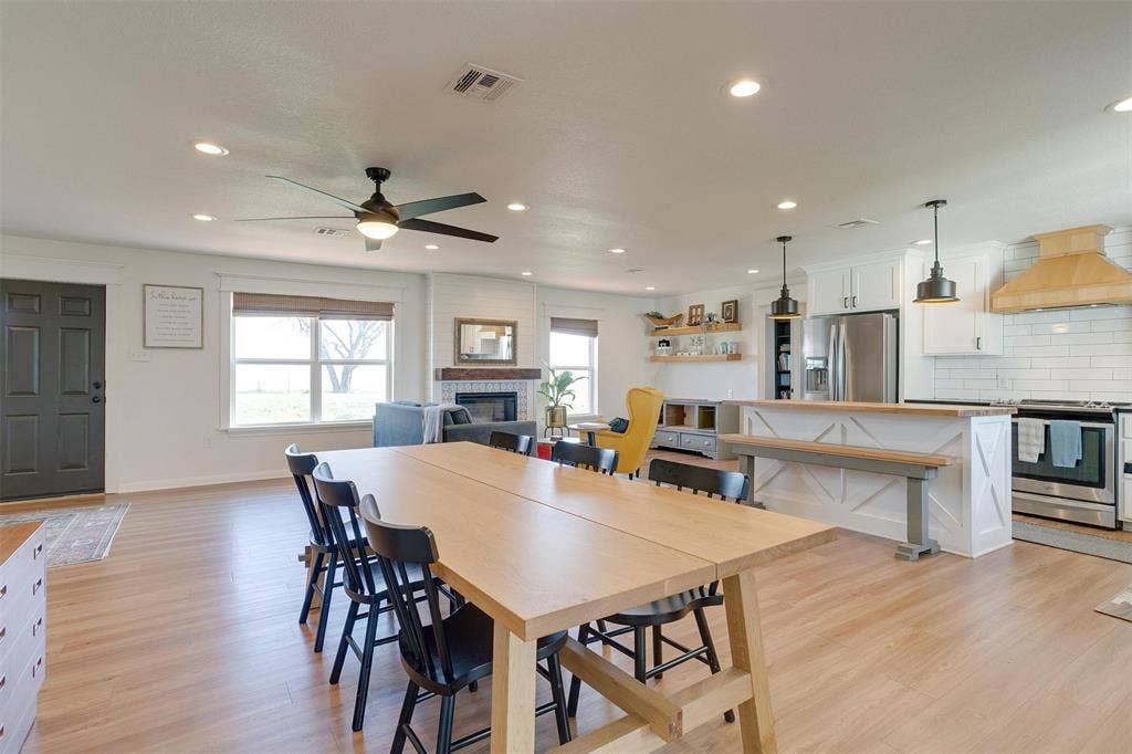 939 Twin Bends Road, Crawford, TX 76638 Dining space with visible vents, recessed lighting, a tile fireplace, ceiling fan, and light wood-type flooring