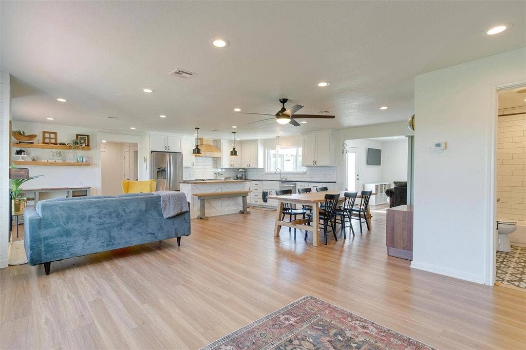 939 Twin Bends Road, Crawford, TX 76638 Living room with recessed lighting, visible vents, light wood-style floors, and a ceiling fan