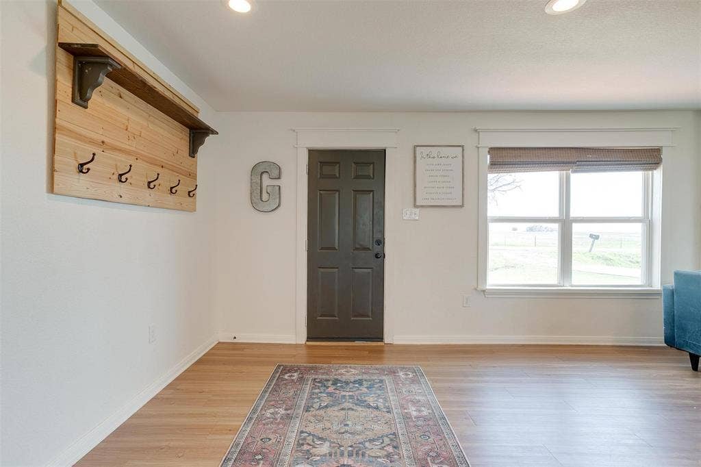939 Twin Bends Road, Crawford, TX 76638 Foyer featuring light wood finished floors, recessed lighting, and baseboards