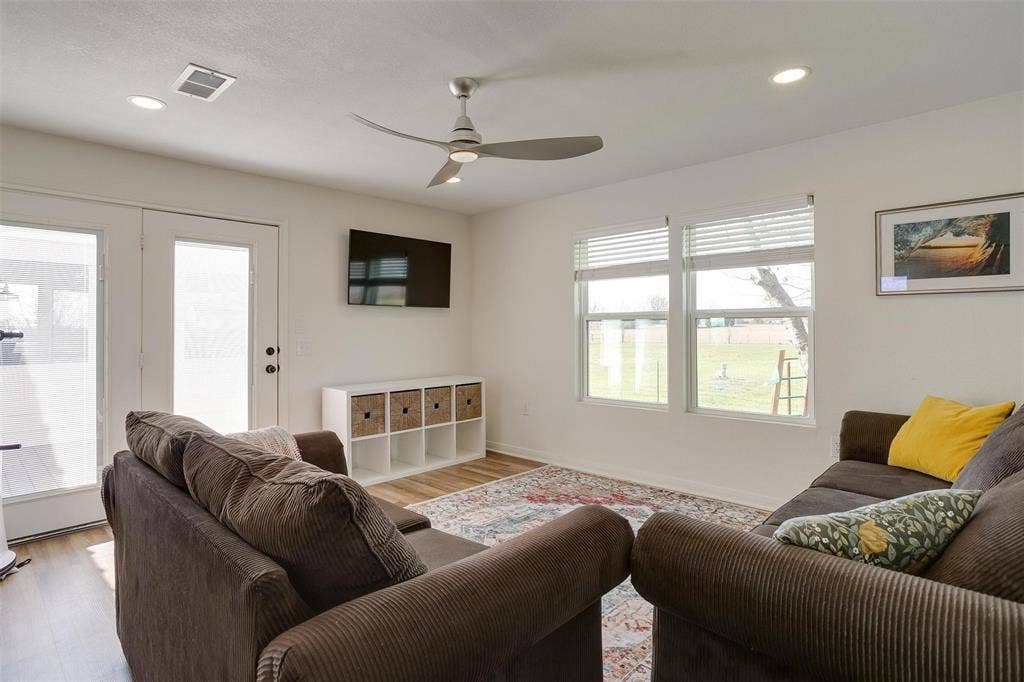 939 Twin Bends Road, Crawford, TX 76638 Living room featuring recessed lighting, visible vents, a ceiling fan, and light wood finished floors
