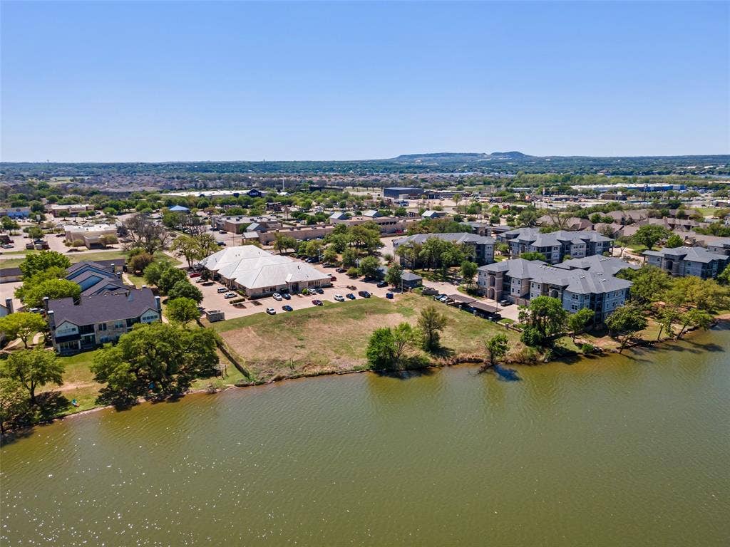 805 Hill Boulevard, Granbury, TX 76048 Aerial view featuring a water view and a residential view