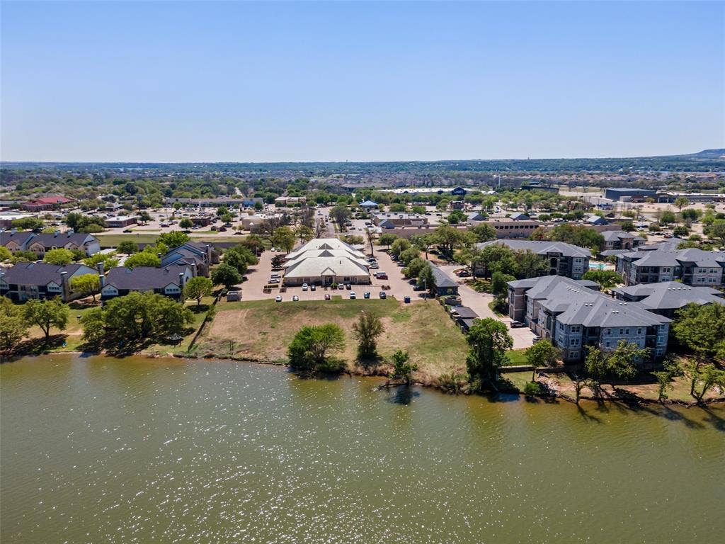 805 Hill Boulevard, Granbury, TX 76048 Aerial view with a residential view and a water view