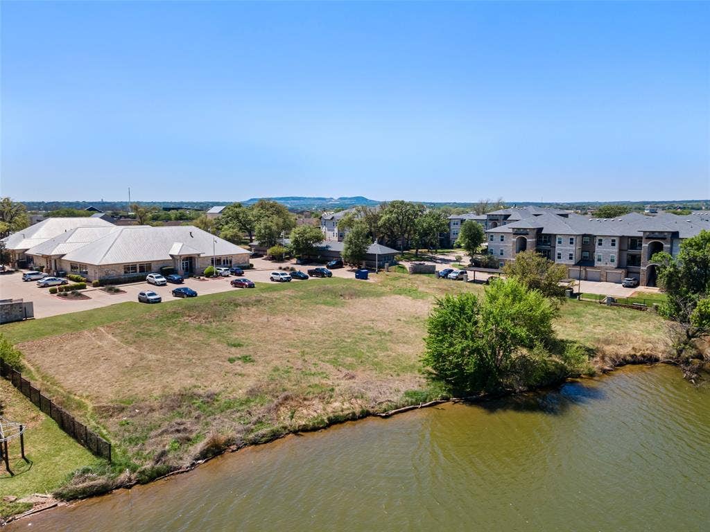 805 Hill Boulevard, Granbury, TX 76048 Drone / aerial view with a residential view