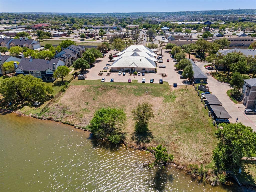 805 Hill Boulevard, Granbury, TX 76048 Drone / aerial view featuring a residential view and a water view