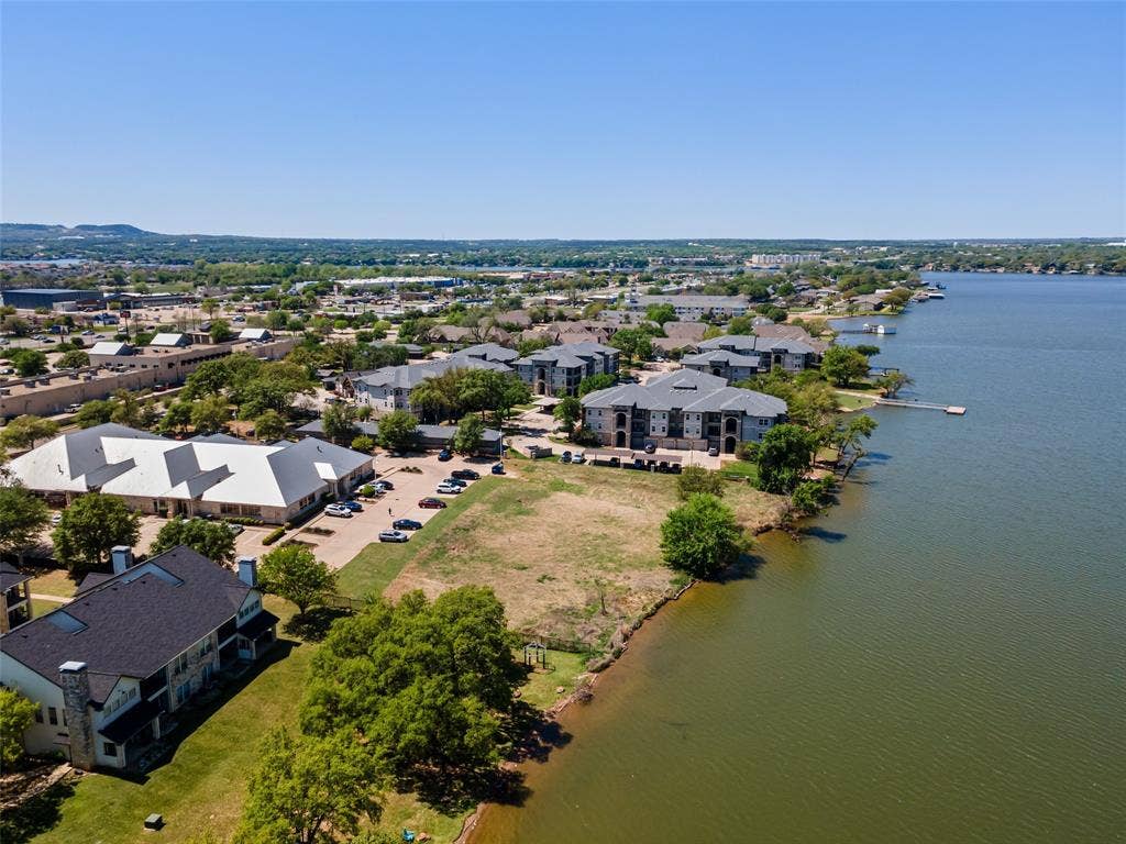 805 Hill Boulevard, Granbury, TX 76048 Drone / aerial view with a water view and a residential view