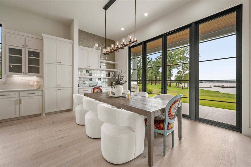 12121 Lighthouse Lane W, Malakoff, TX 75148 Dining room with light wood-style floors, a water view, recessed lighting, and a chandelier