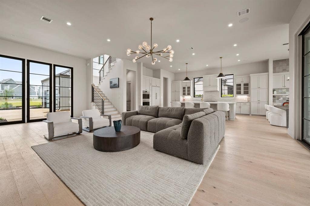 12121 Lighthouse Lane W, Malakoff, TX 75148 Living area with recessed lighting, light wood-style floors, a chandelier, and stairway