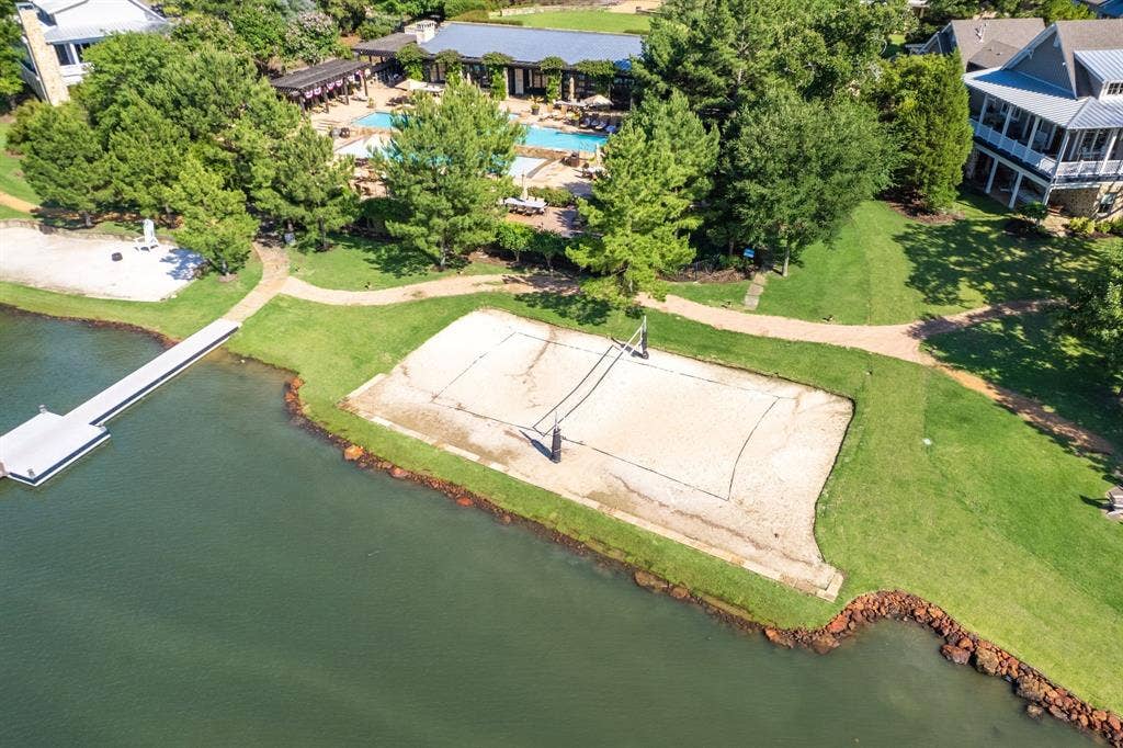 12121 Lighthouse Lane W, Malakoff, TX 75148 Aerial view of a pool area and a nearby body of water