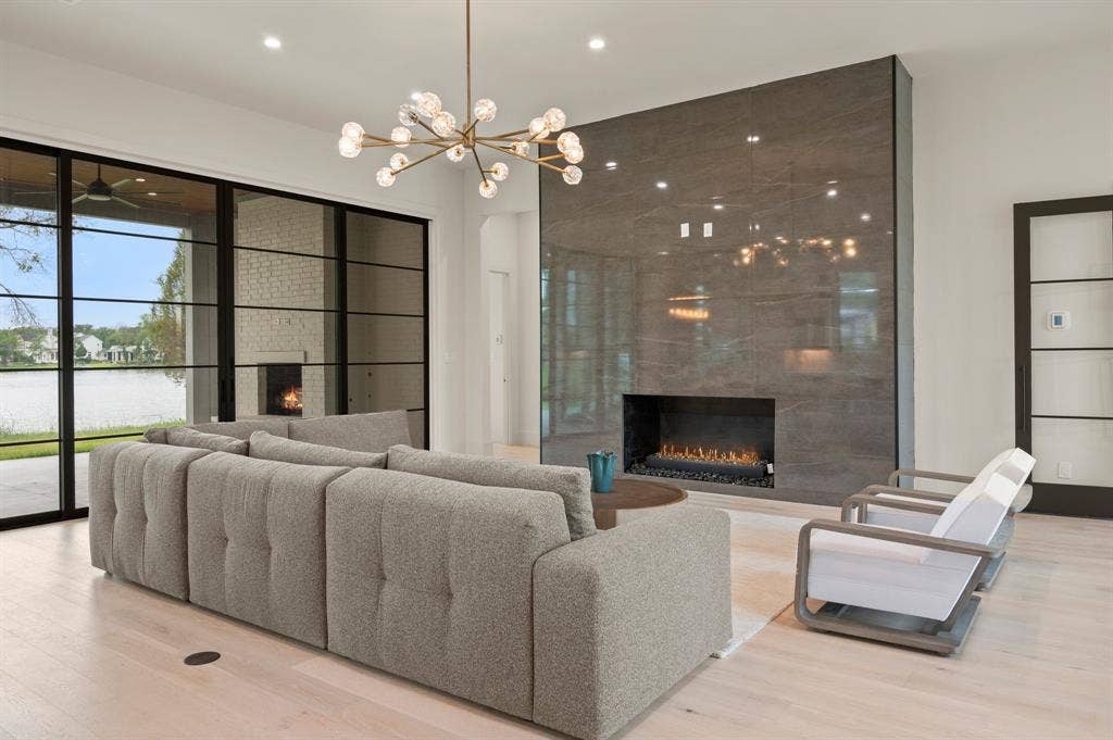 12121 Lighthouse Lane W, Malakoff, TX 75148 Living room with a fireplace, wood finished floors, recessed lighting, and a chandelier