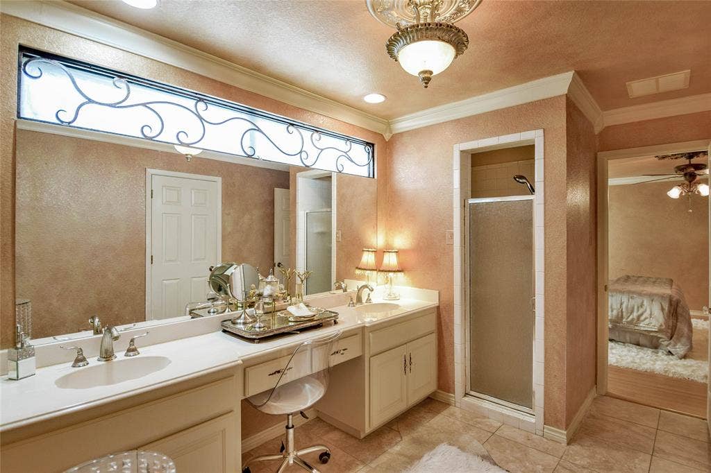 4009 Scenic Way, Granbury, TX 76049 Bathroom featuring double vanity, ornamental molding, a shower stall, tile patterned flooring, and ceiling fan