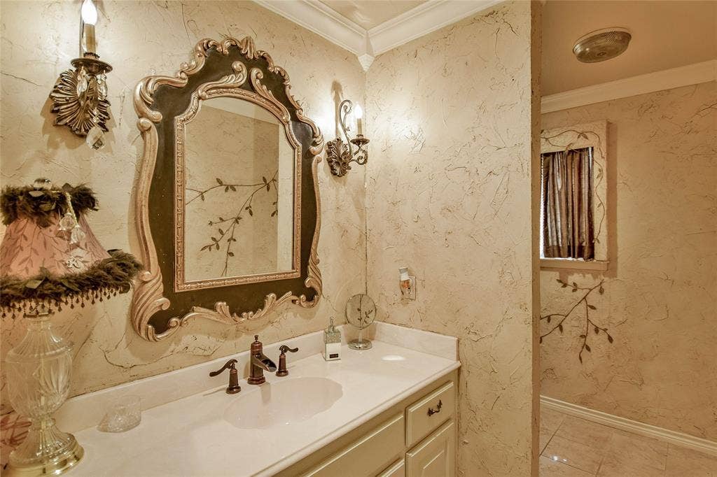 4009 Scenic Way, Granbury, TX 76049 Bathroom featuring vanity, ornamental molding, baseboards, and tile patterned floors