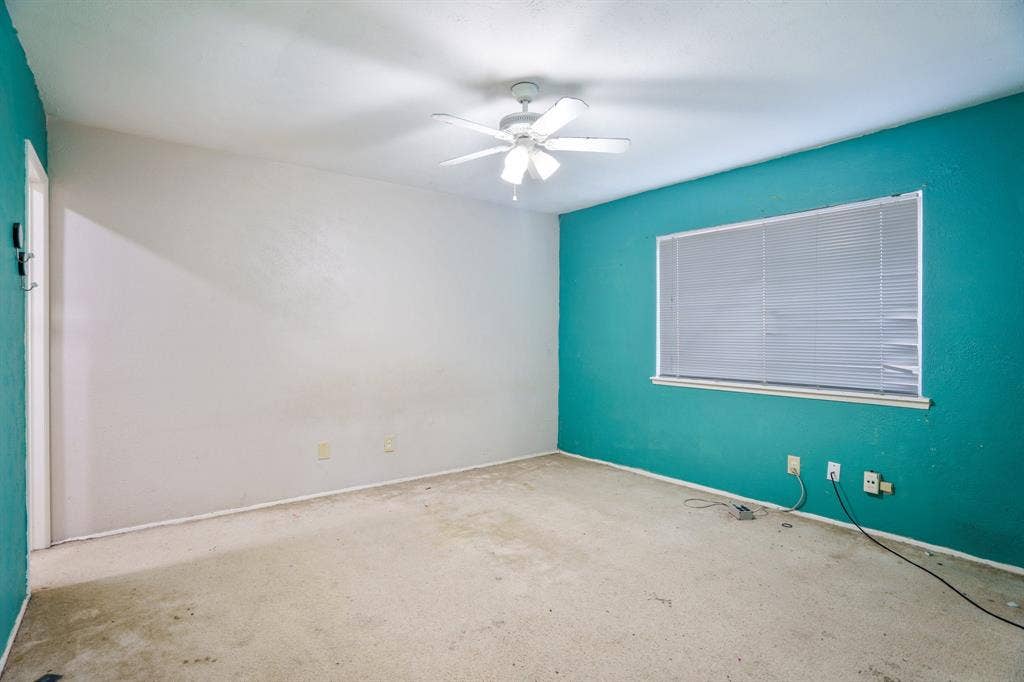 745 Oakland Street, Grand Prairie, TX 75052 Spare room featuring carpet flooring, a ceiling fan, and baseboards
