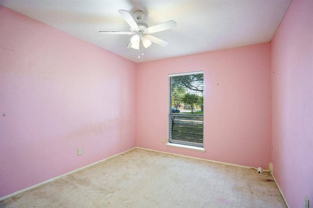 745 Oakland Street, Grand Prairie, TX 75052 Carpeted empty room featuring ceiling fan and baseboards