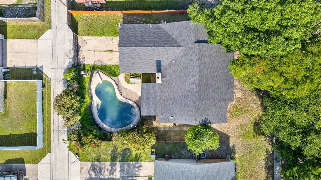 745 Oakland Street, Grand Prairie, TX 75052 Drone / aerial view of a pool area
