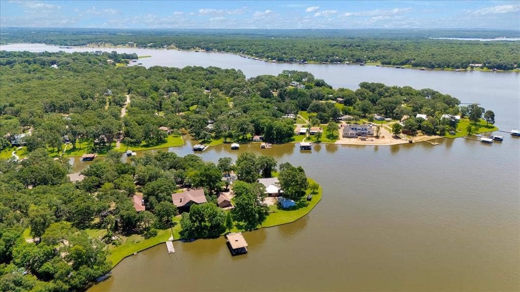 6903 Scott Street, Eustace, TX 75124 Aerial view of a nearby body of water and a forest