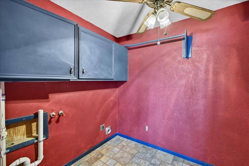 6903 Scott Street, Eustace, TX 75124 Washroom featuring hookup for an electric dryer, cabinet space, a ceiling fan, stone finish flooring, and hookup for a washing machine