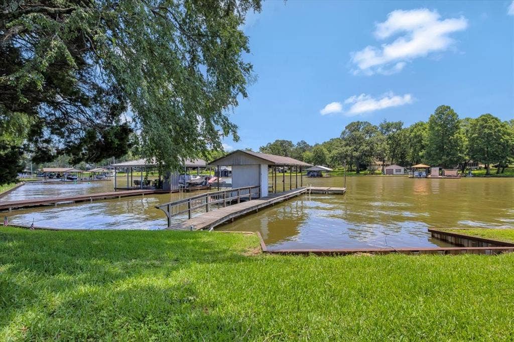 6903 Scott Street, Eustace, TX 75124 Dock featuring a water view and a yard