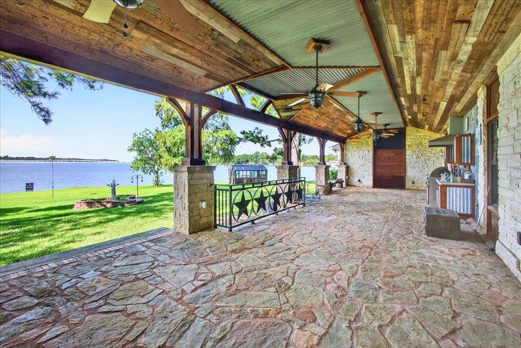 6903 Scott Street, Eustace, TX 75124 View of patio / terrace with a ceiling fan and a water view