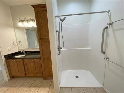 507 E Bryson Street, #A, Athens, TX 75751 Full bath featuring a shower and tile patterned flooring