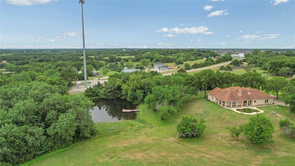 4196 County Road 1001, McKinney, TX 75071 Aerial view of property and surrounding area with a nearby body of water