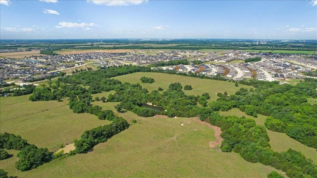 4196 County Road 1001, McKinney, TX 75071 Aerial View of the land at 4195 CR 1001 that butts up against the Eastridge Subdivision