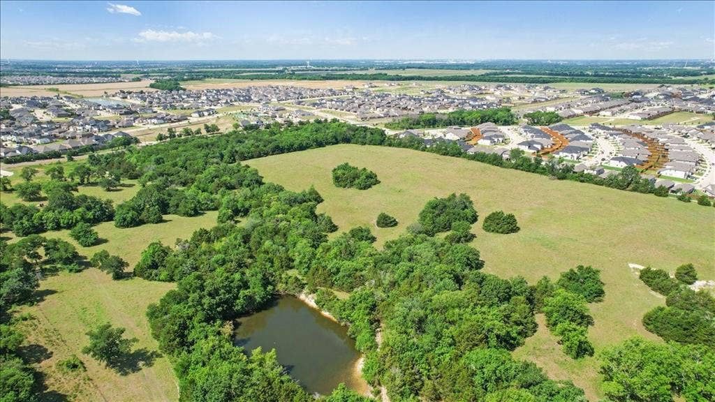 4196 County Road 1001, McKinney, TX 75071 Aerial View of the land at 4195 CR 1001 that butts up against the Eastridge Subdivision