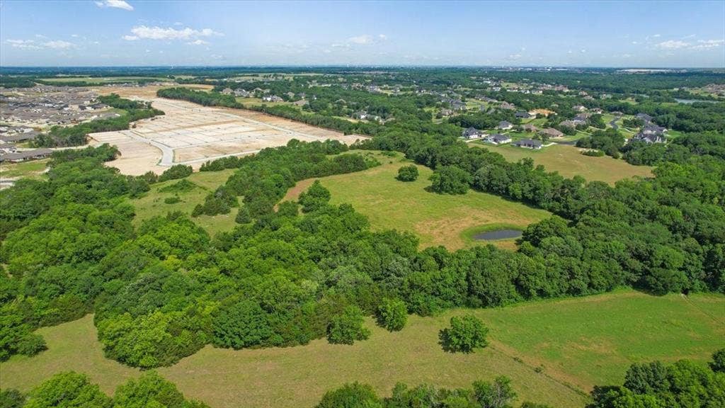 4196 County Road 1001, McKinney, TX 75071 Aerial View of the land at 4195 CR 1001 that butts up against the Subdivision - Eastridges New Phase.