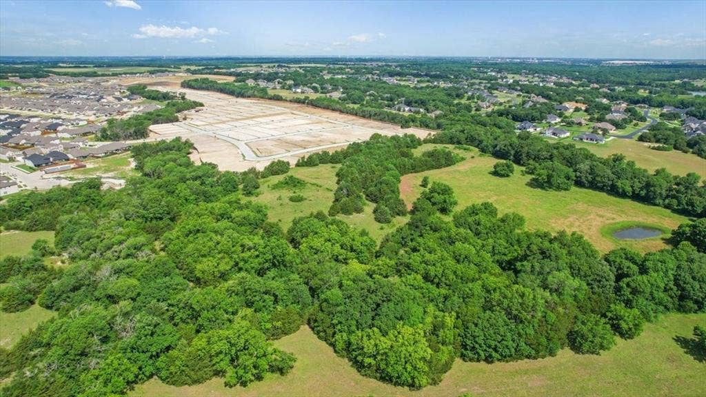 4196 County Road 1001, McKinney, TX 75071 Aerial View of the land at 4195 CR 1001 that butts up against the Subdivision - Eastridges New Phase.
