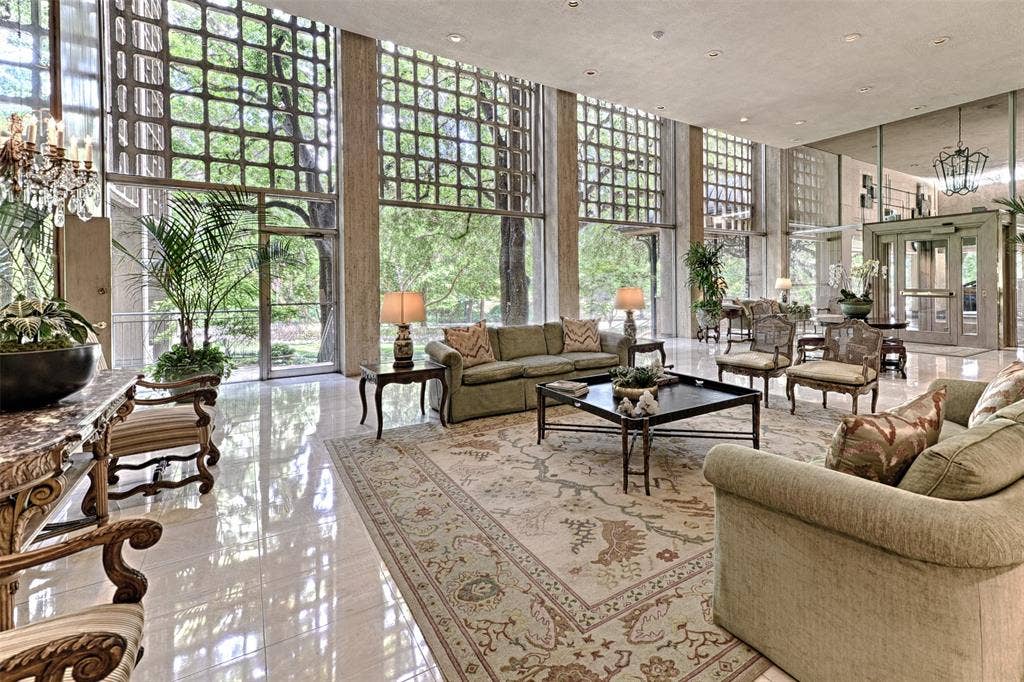 3525 Turtle Creek Boulevard, #4E, Dallas, TX 75219 3525 lobby featuring a high ceiling, expansive windows, and recessed lighting