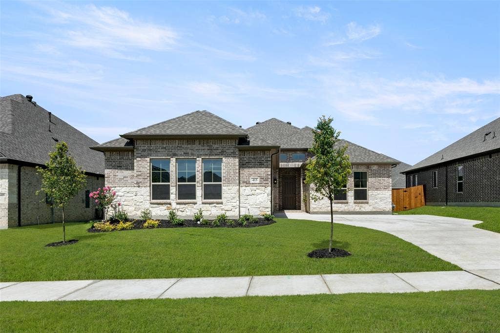 413 Wabash Drive, Waxahachie, TX 75167 French provincial home featuring roof with shingles, brick siding, stone siding, and concrete driveway