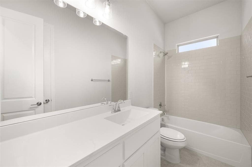 413 Wabash Drive, Waxahachie, TX 75167 Full bath featuring vanity, bathtub / shower combination, and tile patterned floors