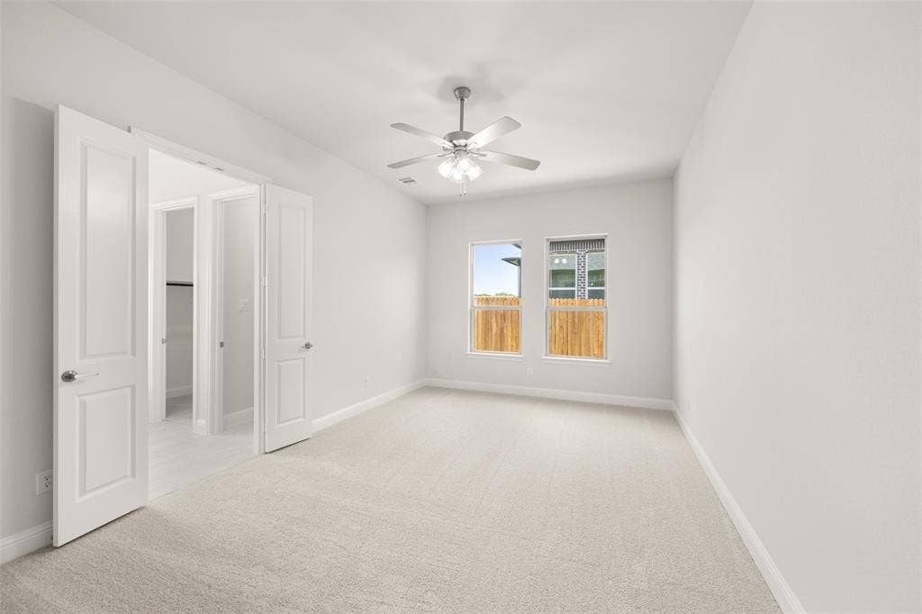 413 Wabash Drive, Waxahachie, TX 75167 Empty room featuring carpet flooring and ceiling fan