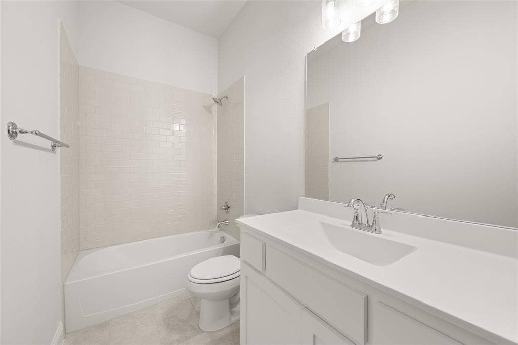 413 Wabash Drive, Waxahachie, TX 75167 Full bathroom with vanity, bathing tub / shower combination, and tile patterned flooring