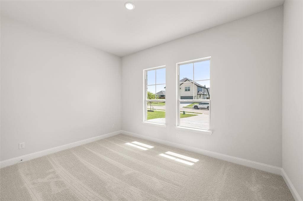 413 Wabash Drive, Waxahachie, TX 75167 Empty room featuring carpet flooring and recessed lighting
