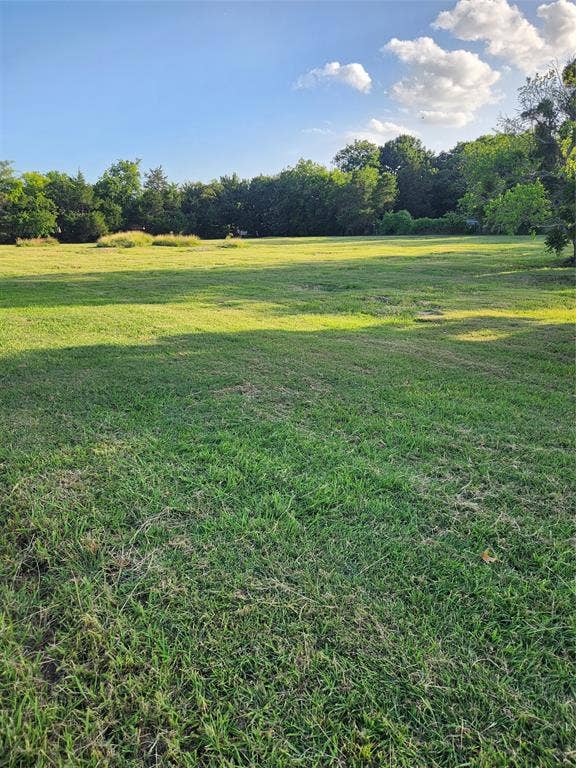 View of grassy yard with a view of countryside