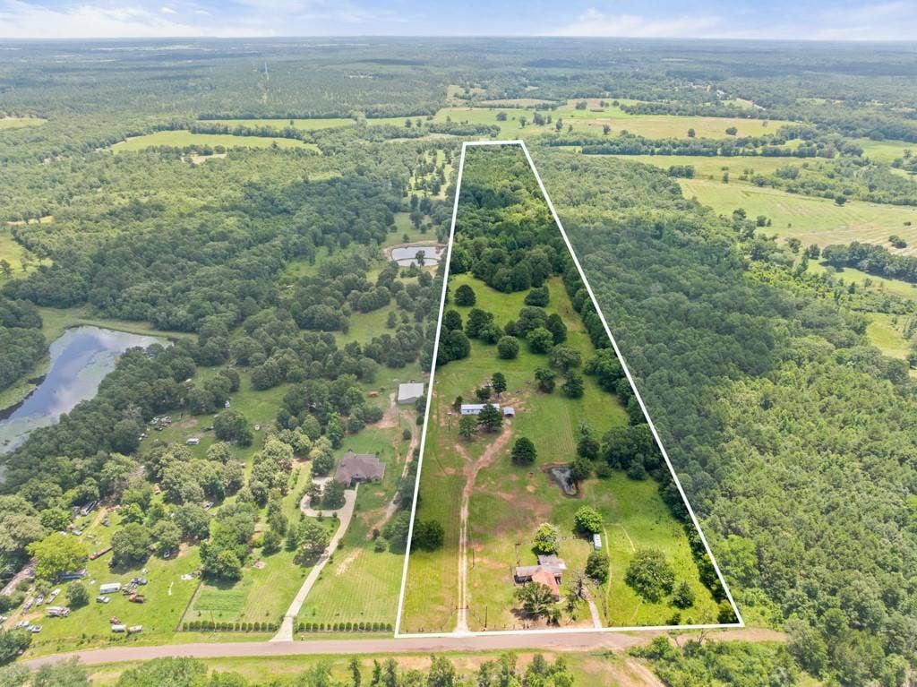 5353 CR 385, Tyler, TX 75708 Aerial overview of property's location featuring a large body of water and property parcel outlined